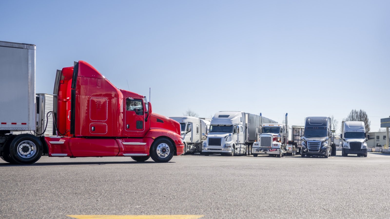 tractor trailers parked in a row